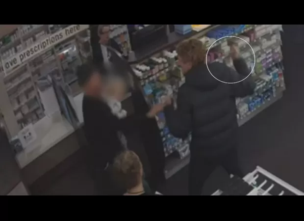 A father was reportedly attacked by a man wielding a knife at a pharmacy in Victoria.