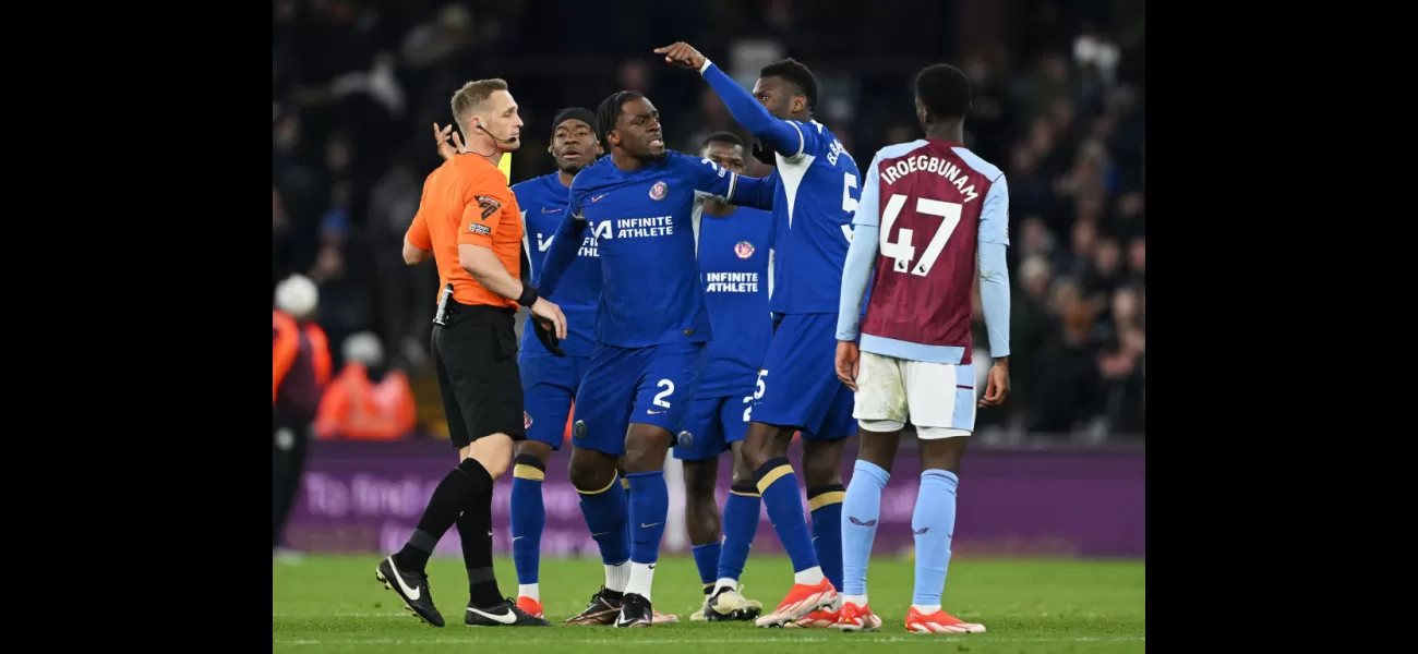 A Chelsea player loudly confronts the referee and is forcibly removed during a tense moment.