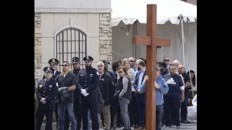 Officer Luis Huesca's death is being mourned at his visitation, as it is seen as an attack on the entire community.