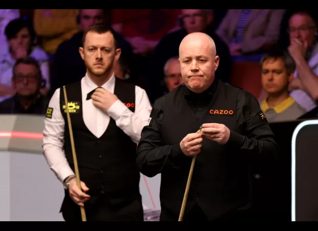 Higgins and Bingham win thrilling matches in an eventful night at the Crucible.