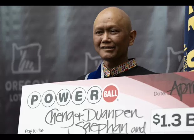 An immigrant with cancer is grateful after winning a $1.3 billion lottery prize.