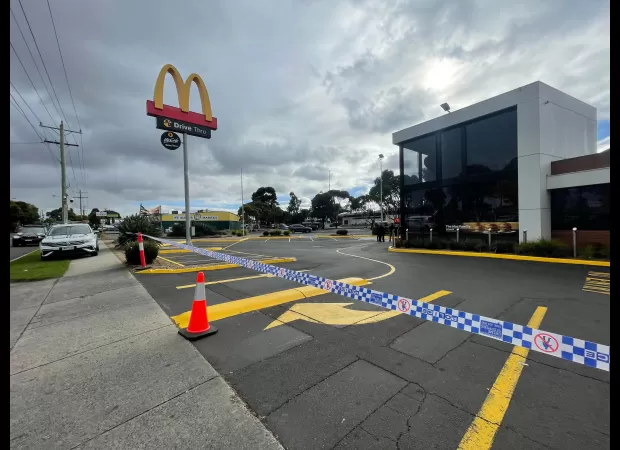 A person is in critical condition after being stabbed outside a McDonald's in Melbourne.