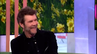 Comedian Rhod Gilbert returns to the stage after battling cancer, acknowledging that the experience may have a lasting impact on him.