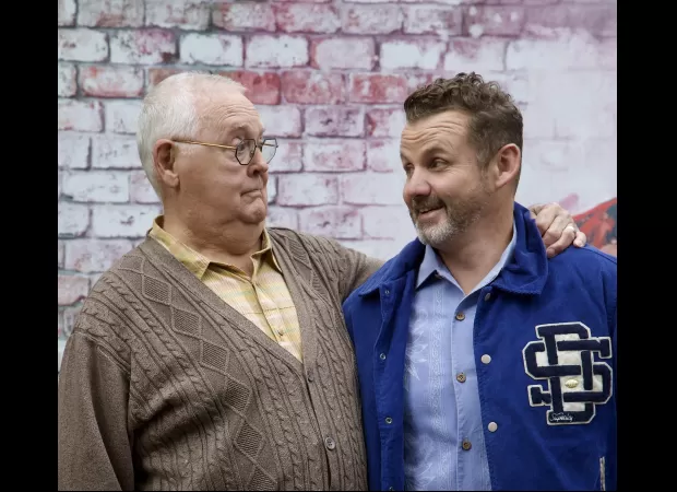 Iconic star of Neighbours announces their return to the show with a specified date.