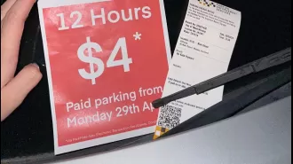 A woman was surprised when a car park was set up around her parked car and she received a ticket.