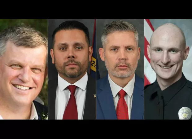 Police officers killed in a standoff at a residence.