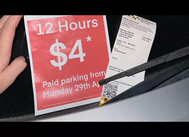 A woman was surprised when a car park was set up around her parked car and she received a ticket.