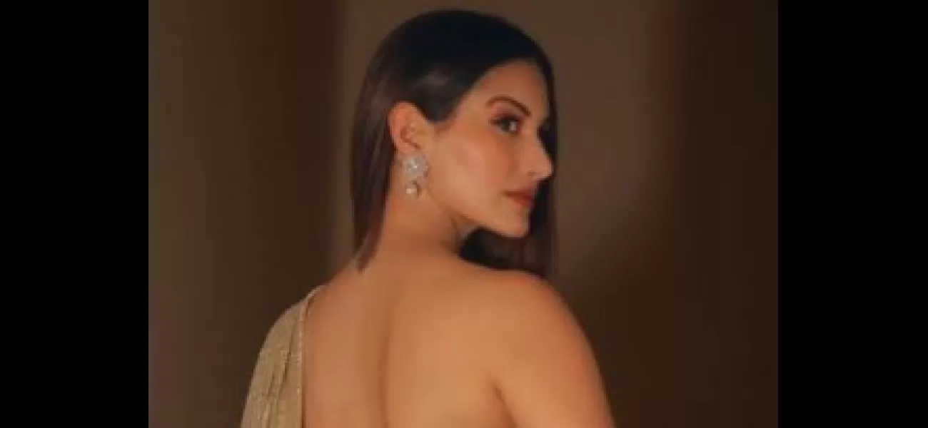 Amyra Dastur looks stunning in a gold saree.