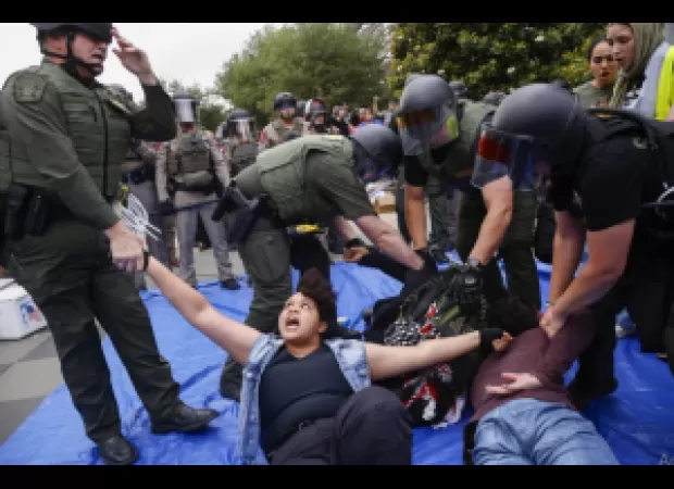 Cops dismantle Palestinian protesters' camp at UCLA.