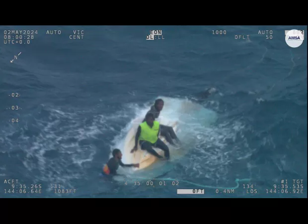 Three individuals saved from capsized boat in Australia.