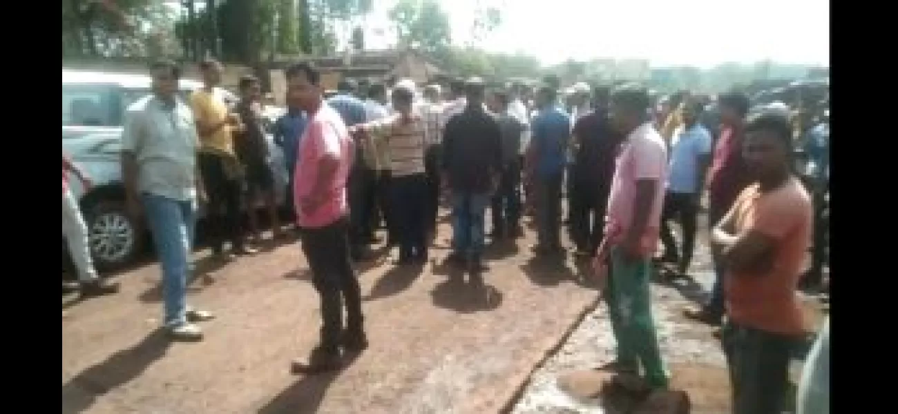 Protesters stop official from entering plant grounds, demanding better working conditions.