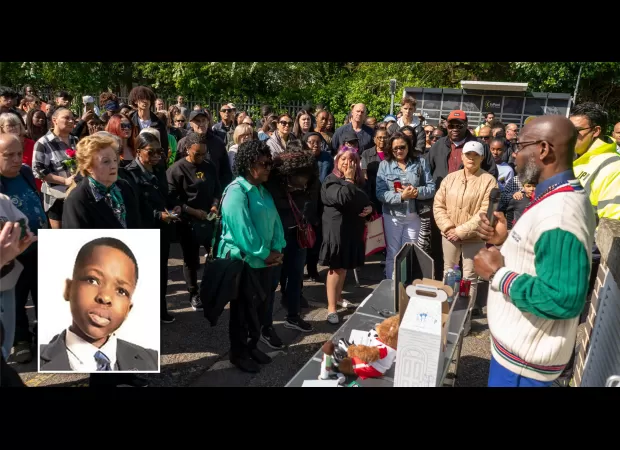 A large crowd attends vigil for boy who died in Hainault sword attack.