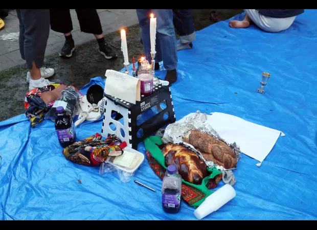 Jewish activists at U. of C. camp explain the meaning behind their anti-Zionist Shabbat service.