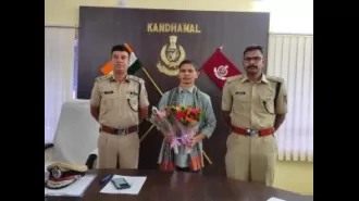 A Maoist surrenders to Odisha Police.
