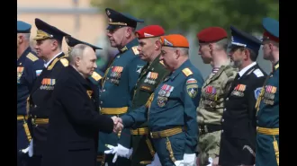 Cybercriminals attack media coverage of Putin's parade to liken him to Hitler.