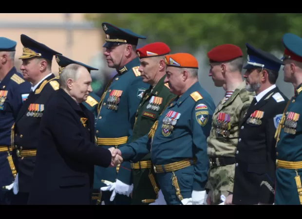 Cybercriminals attack media coverage of Putin's parade to liken him to Hitler.