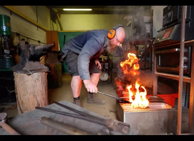 Eco-friendly knives made from beach litter and laughing gas canisters by a skilled blademaker.