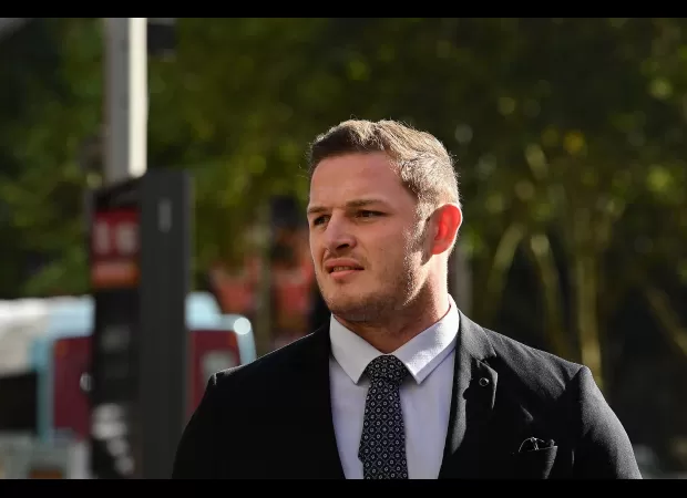 NRL champion found not guilty of touching woman inappropriately.