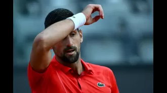 Tennis star Djokovic knocked down by water bottle while signing autographs during Italian Open.