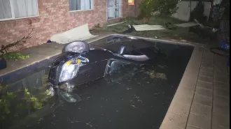 A driver crashes car into pool, escapes while soggy.