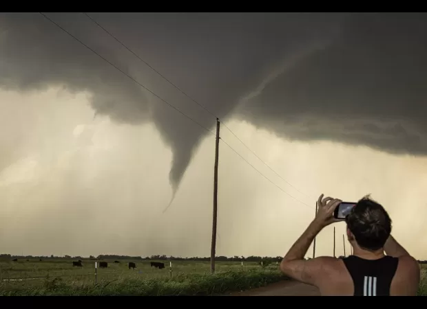 A person from Queensland becomes an experienced storm chaser in the United States.