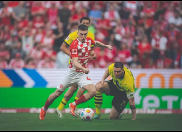 Mainz relieved relegation fears with surprise win against Dortmund in German league.