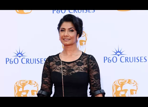 EastEnders star Balvinder Sopal arrives at Baftas with crutches and boot due to injury.