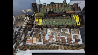 SA property raided, weapons confiscated: rifle, crossbow, and bomb.