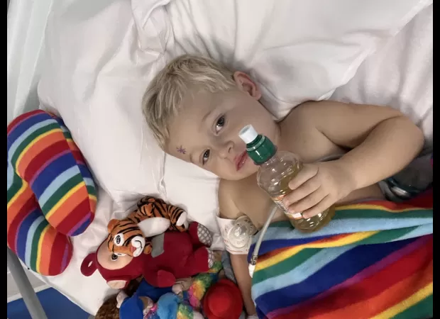 Mom discovered son's cancer by noticing strange detail in vacation picture.