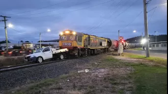 A man narrowly avoids being hit by a train after jumping out of his ute at the last minute.