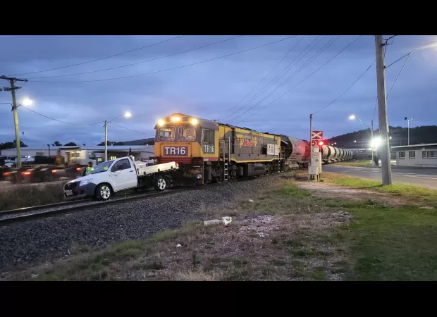 A man narrowly avoids being hit by a train after jumping out of his ute at the last minute.