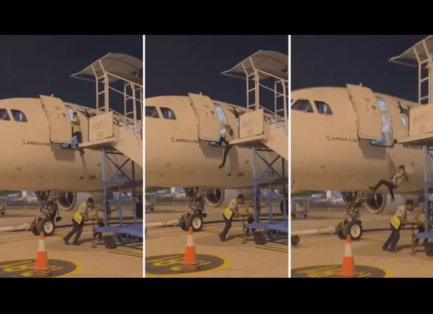 Indonesian airline employee drops from aircraft when stairs are removed.