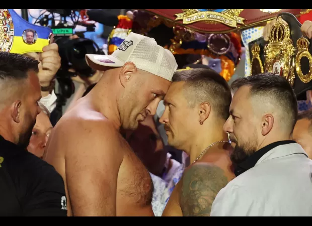 Boxers Tyson Fury and Oleksandr Usyk had to be separated by security at a heated weigh-in.