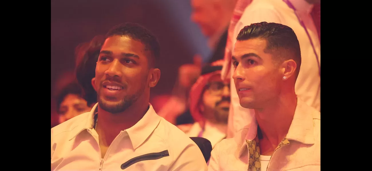 British boxer Anthony Joshua and Portuguese footballer Cristiano Ronaldo watch Tyson Fury vs Oleksandr Usyk match together at ringside.