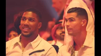 British boxer Anthony Joshua and Portuguese footballer Cristiano Ronaldo watch Tyson Fury vs Oleksandr Usyk match together at ringside.