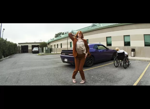 Roman-inspired Emma Stone movie with group sex and cooked finger.