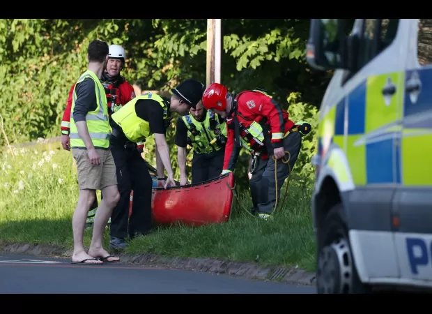 Massive search launched after two young boys disappear while swimming in river.