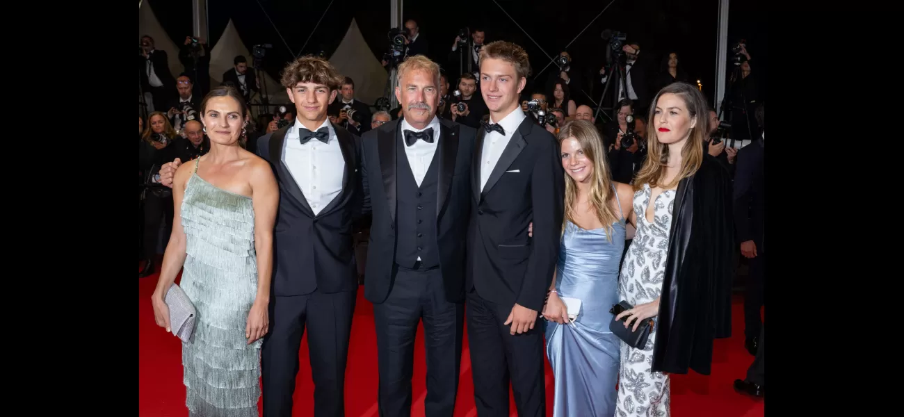 Kevin Costner proudly poses with five of his seven children at the premiere of his film Horizon in Cannes.