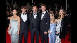 Kevin Costner proudly poses with five of his seven children at the premiere of his film Horizon in Cannes.