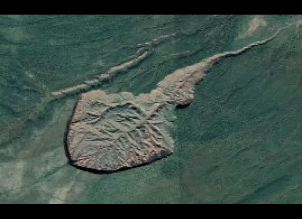 A voracious 'mouth of hell' continuously consumes surrounding land without any means of halting its progress.