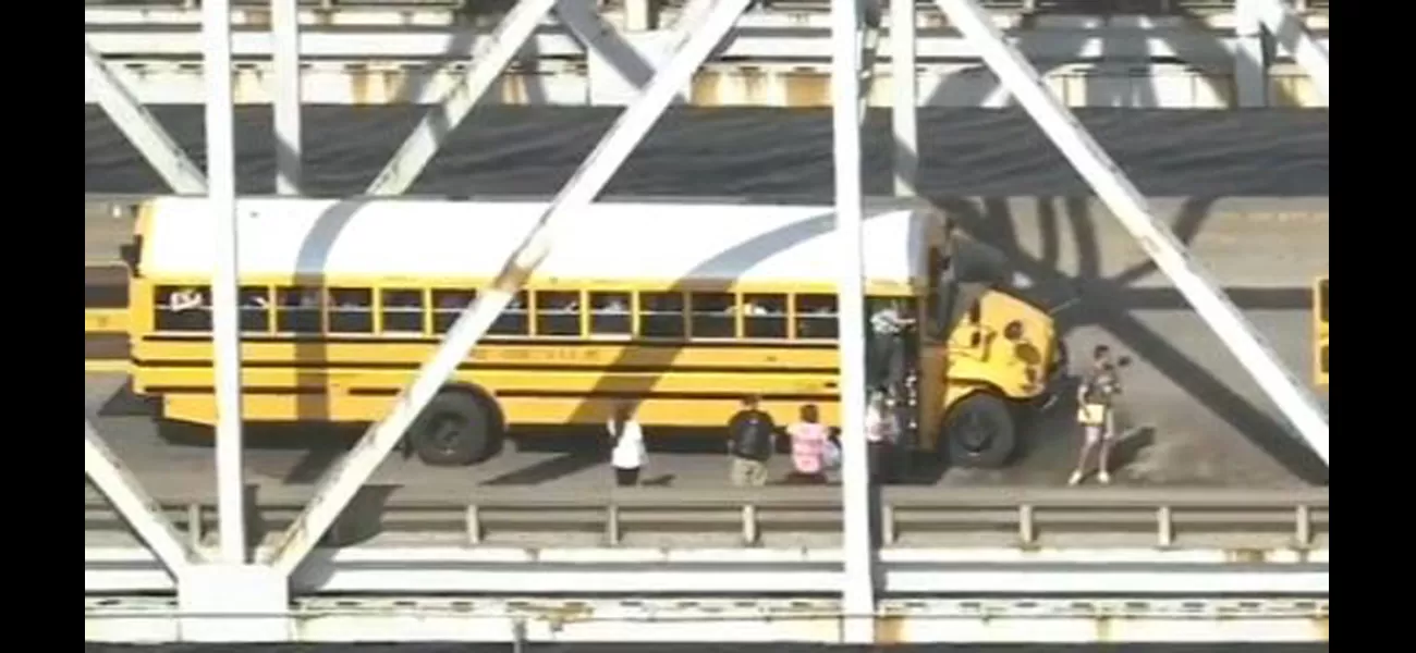 Three school buses crash into each other on a bridge.