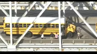 Three school buses crash into each other on a bridge.