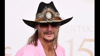 Kid Rock is accused of making racist comments and brandishing a gun while being interviewed, and admits to contributing to the division in America.