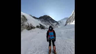 A climber and sherpa are missing on Mount Everest after a failed summit attempt.