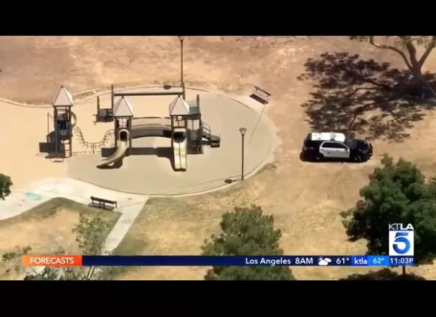 A young boy was discovered deceased in a playground and his father was taken into custody.
