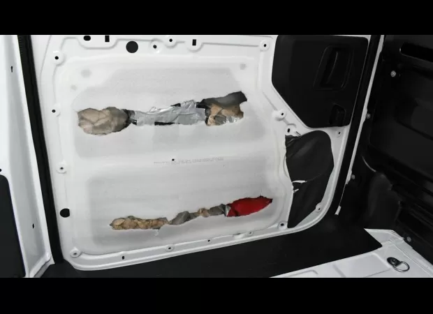 Drugs worth millions discovered concealed in vans.