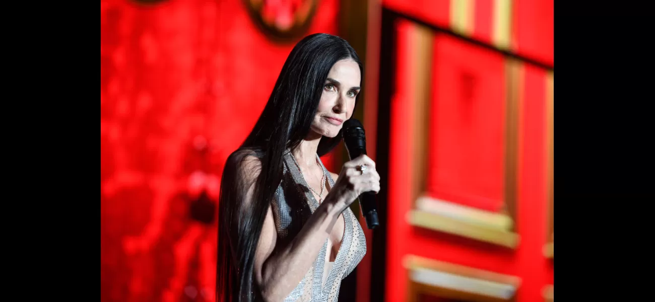 Demi Moore angrily chides crowd while presenting Cher at Cannes.