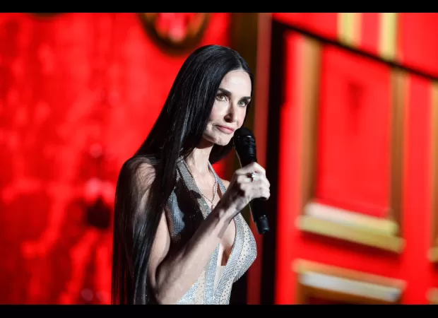 Demi Moore angrily chides crowd while presenting Cher at Cannes.