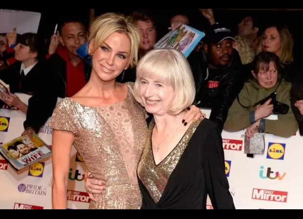 Sarah Harding's mother, Marie, seen smiling with joy after an emotional performance by Girls Aloud.