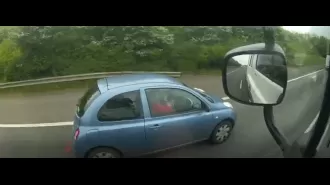 Bad British drivers caught multi-tasking as they type on laptops and steer with knees.